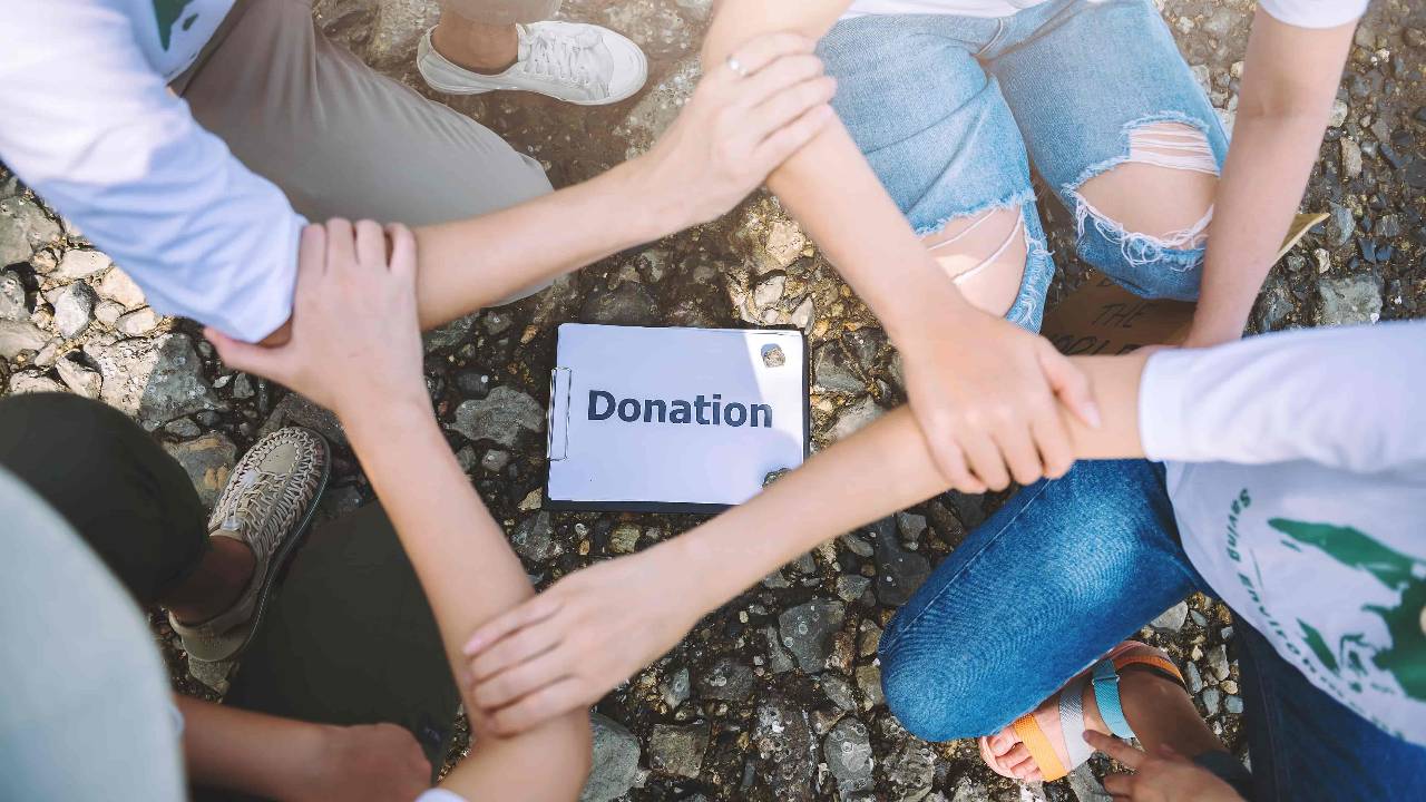 Close up people volunteer teamwork join hands together stack hands unity teamwork volunteering conceptual