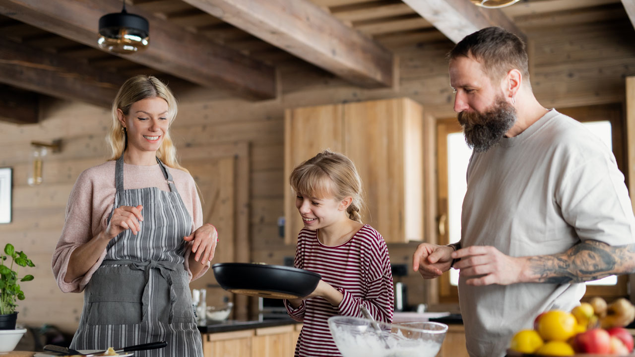 family having good time baking